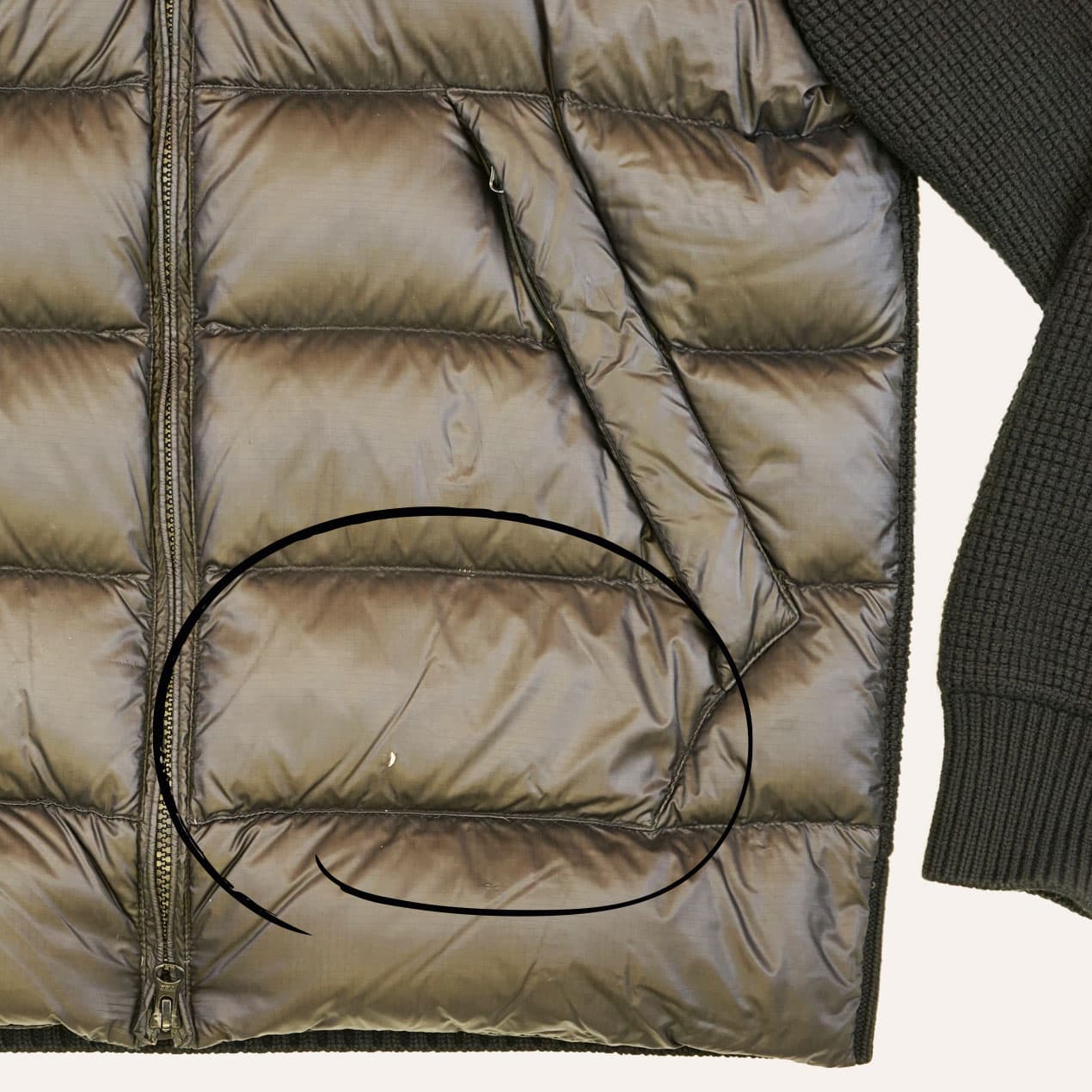 Example 2: C.P. Company jacket with a hole below the side pocket: the panel is damaged.