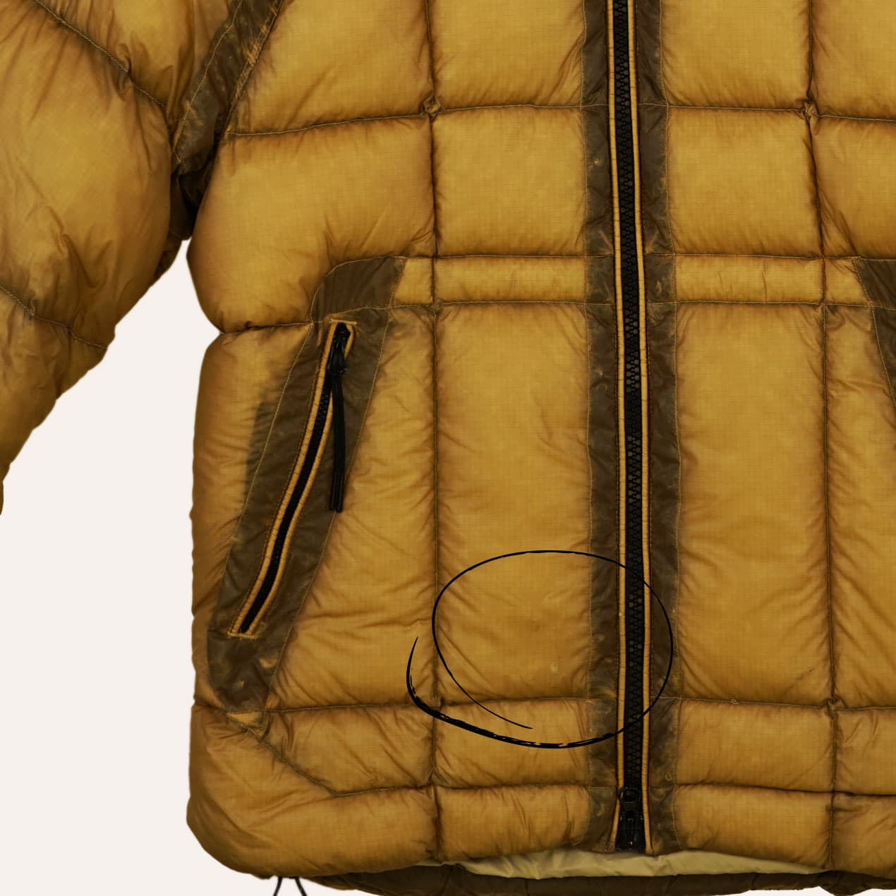 Example 5: Yellow DD Shell jacket with damaged lower panel.