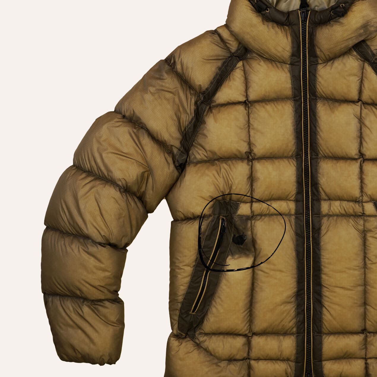 Example 6: Ochre DD Shell jacket with damaged panel near the pocket zip.
